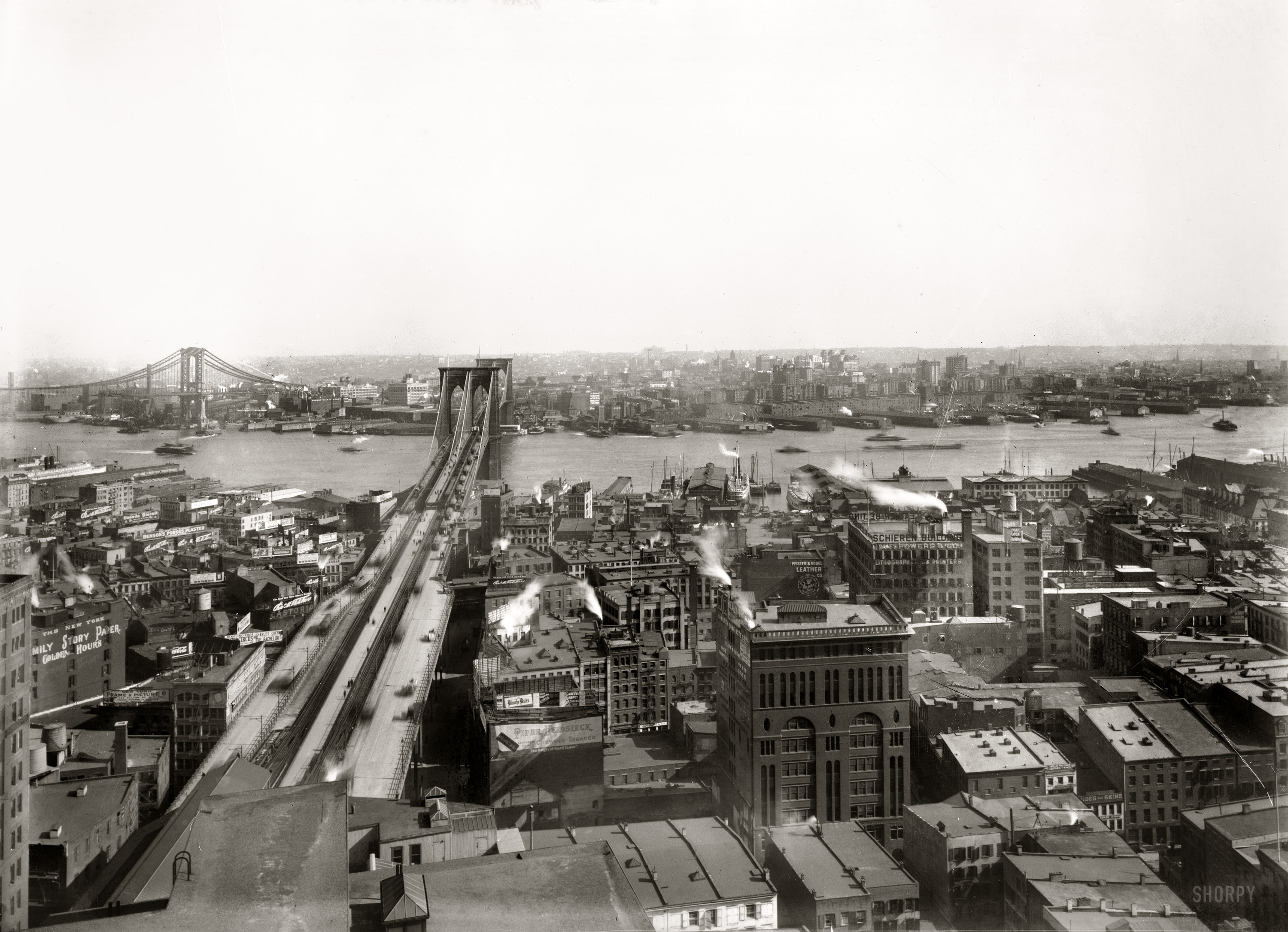 "Brooklyn Bridge and East River. April 1909." At left, the Manhattan Bridge under construction in this view looking east into Brooklyn with Manhattan Terminal at lower left. 8x10 glass negative, George Grantham Bain Collection. View full size.
