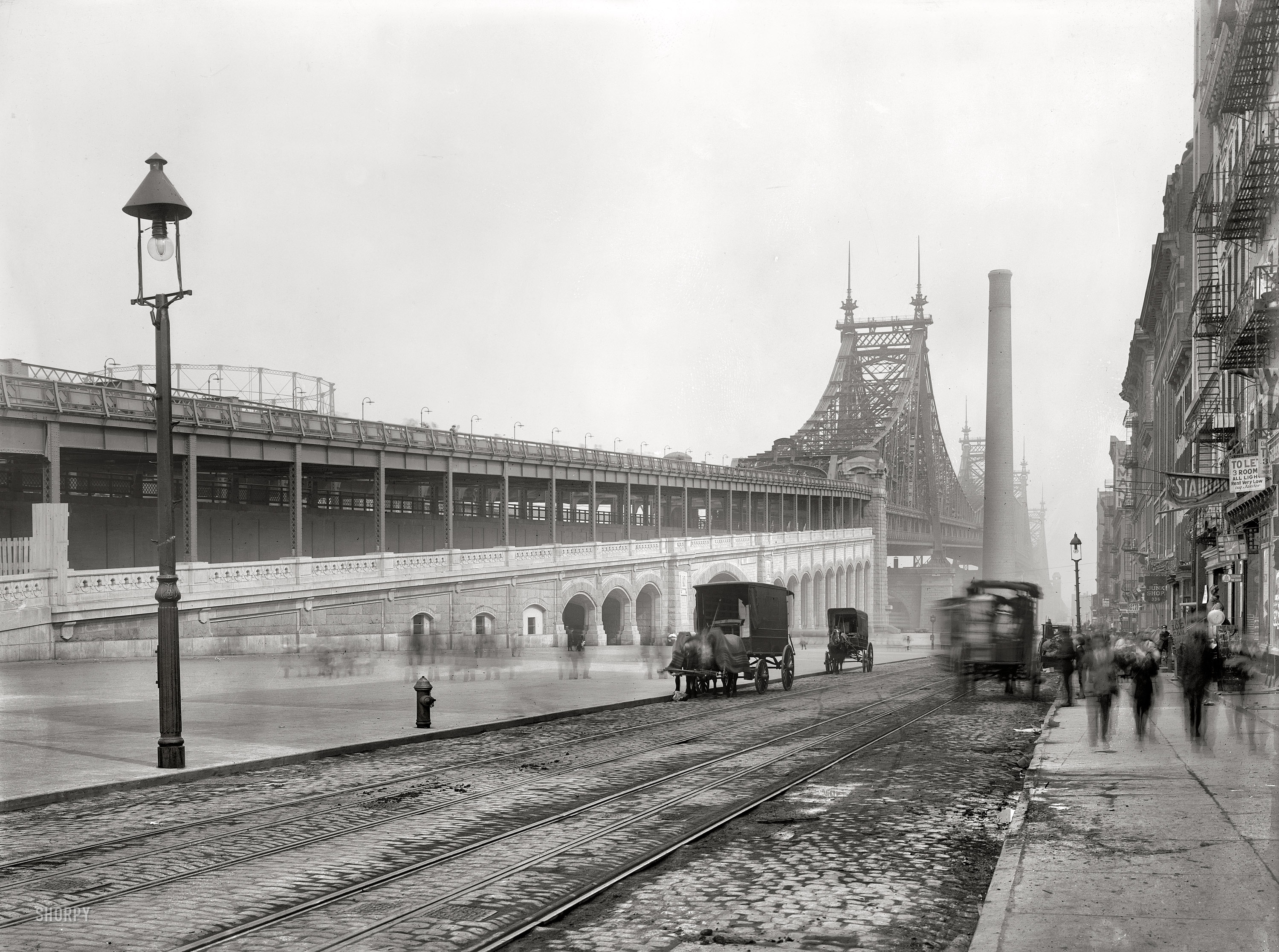 New York, 1909. The new Queensboro (59th Street) Bridge over the East River. 8x10 inch glass negative, George Grantham Bain Collection. View full size.