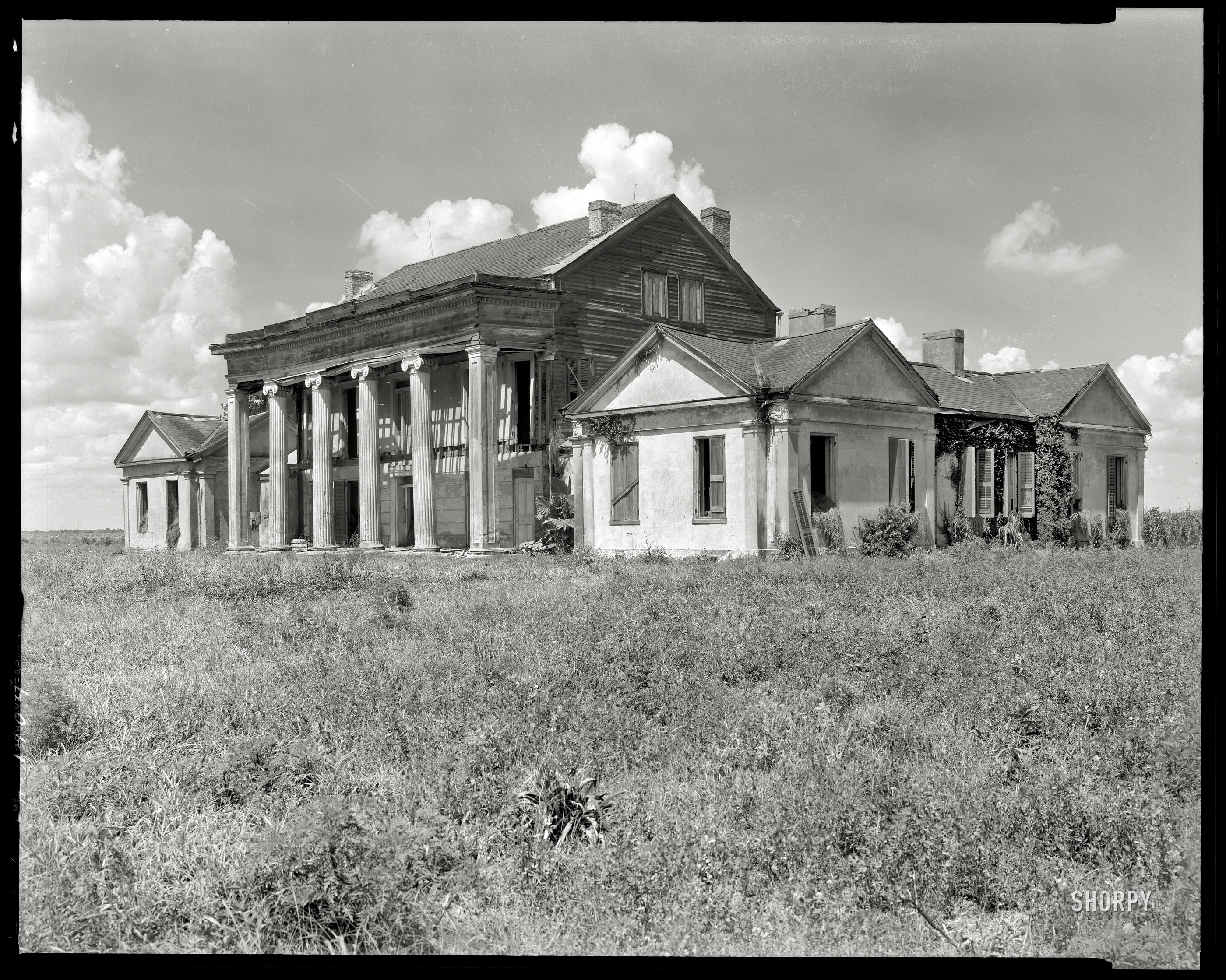 Assumption Parish, Louisiana, 1938. "Woodlawn Plantation, Napoleonville vicinity. Built 1835 by Col. W.W. Pugh, first superintendent of schools in Louisiana." 8x10 inch negative by Frances Benjamin Johnston. View full size.