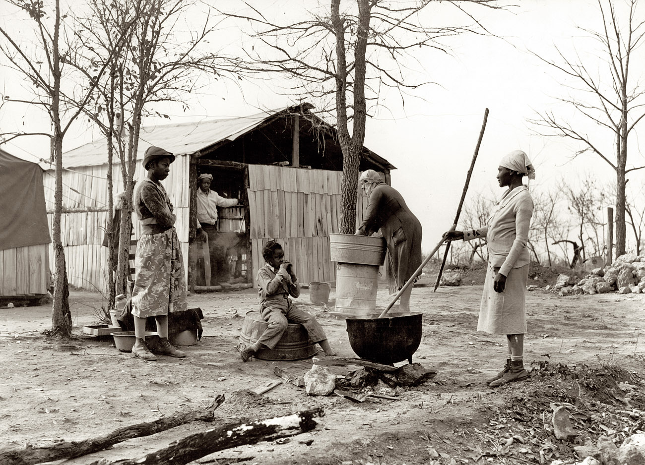 November 1939. Butler County, Missouri. "Washing clothes at camp for evicted sharecroppers." View full size. Medium format negative by Arthur Rothstein.