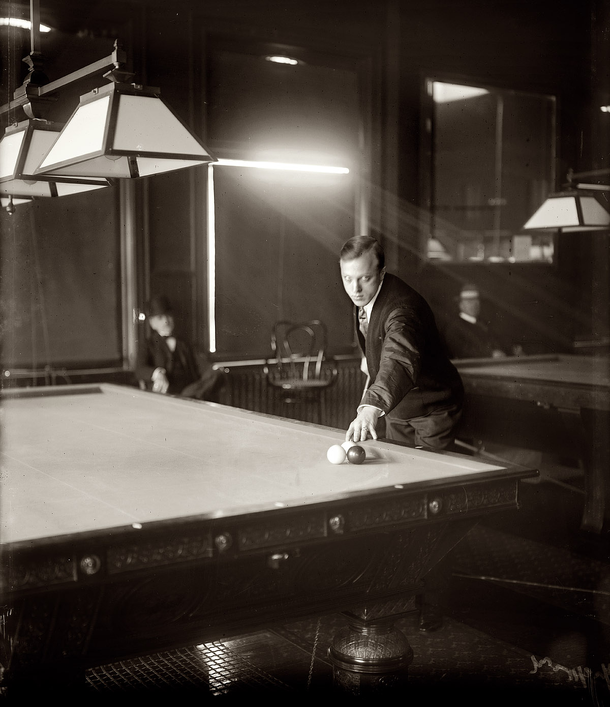 January 1909. Billiard champion Calvin Demarest in New York, seven years before his prematurely reported death. From his 1916 obituary, headlined "Calvin Demarest Dead -- Noted Billard Player Expires in Illinois Insane Asylum": CHICAGO, Feb. 22. Calvin S. Demarest, former amateur champion billiard player and later a professional, died at the Elgin Asylum for the Insane last night. Demarest suffered a nervous breakdown last June and attacked his wife with a knife. She was saved from serious injury by Demarest's mother. The billiardist was taken for treatment to a rest cure, but failed to improve and was removed to the asylum. As it turned out, Calvin was very much alive. In 1925, though, he died before his time. View full size. George Grantham Bain Collection.