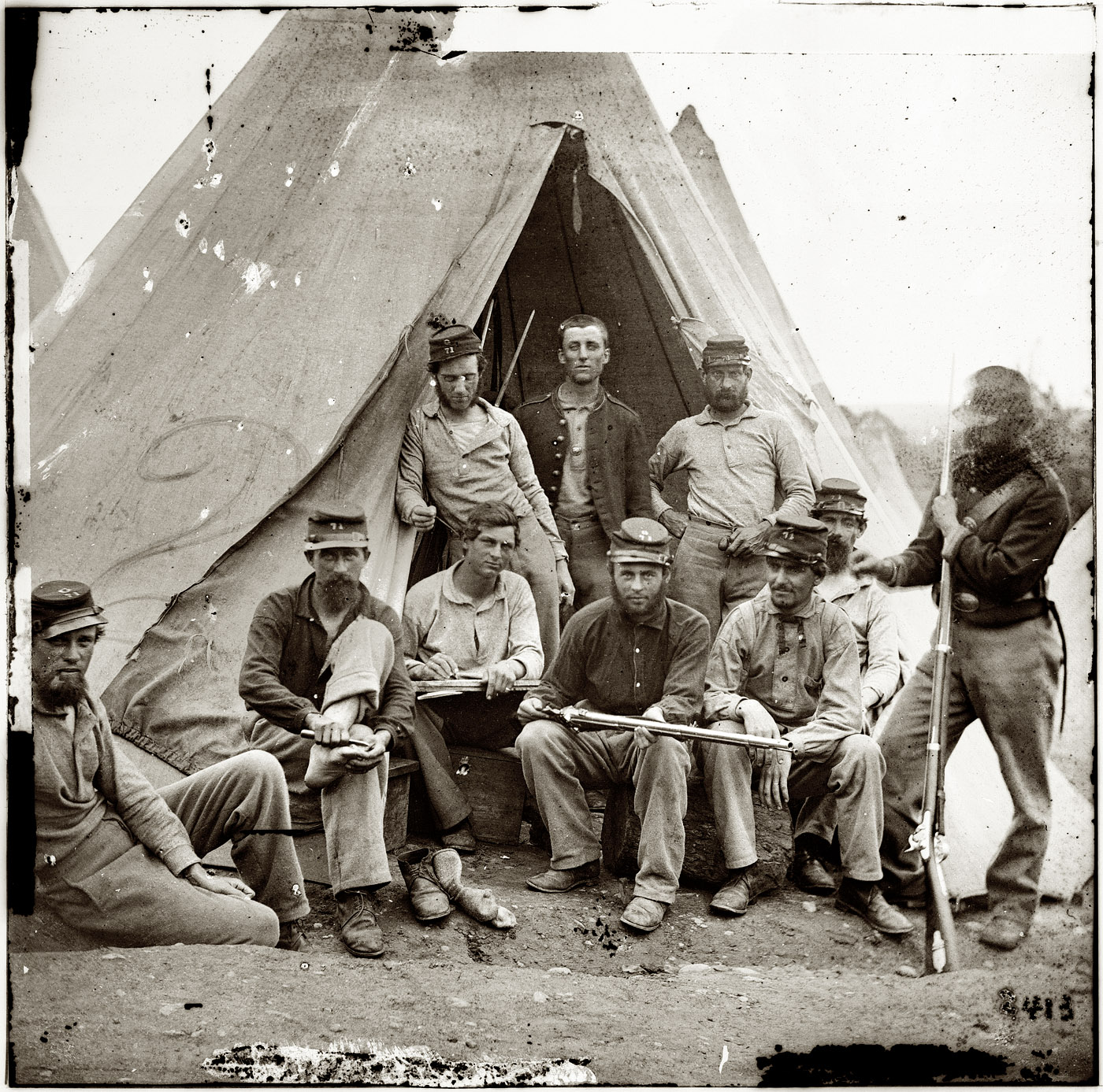 1861. "Soldiers of Company G, 71st New York Volunteers, in front of Sibley tent." Wet plate glass negative, left half of stereograph pair. Photographer unknown. Civil War glass negative collection, Library of Congress. View full size.