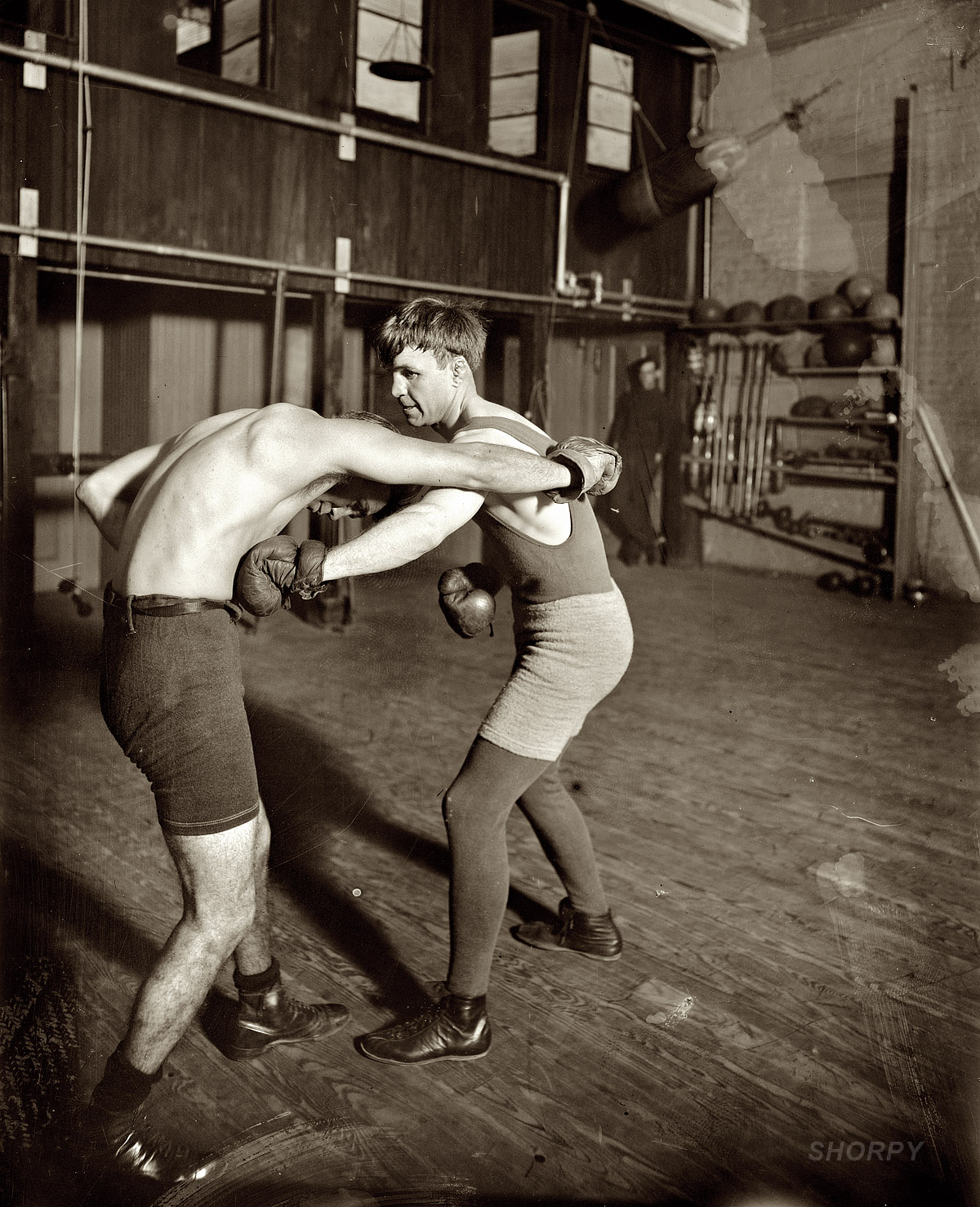 Lightweight boxing champ "Bat" Nelson in 1911. After retiring from the ring, Bat (short for Battling; aka the Durable Dane, born Oscar Nielsen) dabbled in fight promotion and vaudeville. In January 1954, "a pathetic little man of 80 pounds, his mind a complete blank," Bat was committed to the Chicago State Hospital; a month later he was dead of lung cancer at age 71. With 68 wins, 19 draws and 19 losses, Bat once said that although he had "lost several fights," he had never been beaten. 8x10 glass negative, George Grantham Bain Collection. View full size.