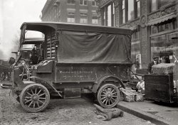 Washington, 1912. "Woodward & Lothrop department store trucks." A detailed look at an early motor truck. Harris & Ewing glass negative. View full size.