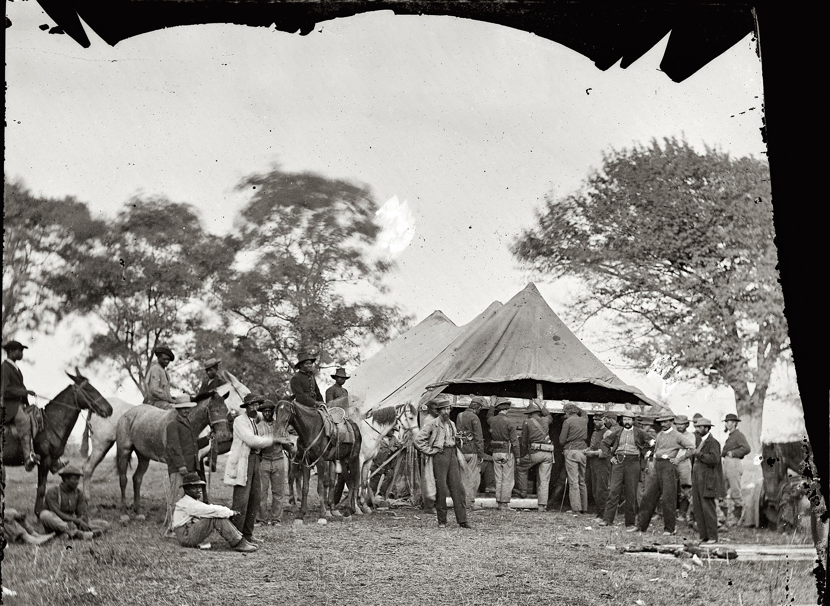 May 1864. "Fredericksburg, Va. Soldiers filling canteens." Photographs from the main Eastern theater of war, Grant's Wilderness Campaign, May-June 1864. Wet plate glass negative, half of stereo pair, photographer unknown. View full size.