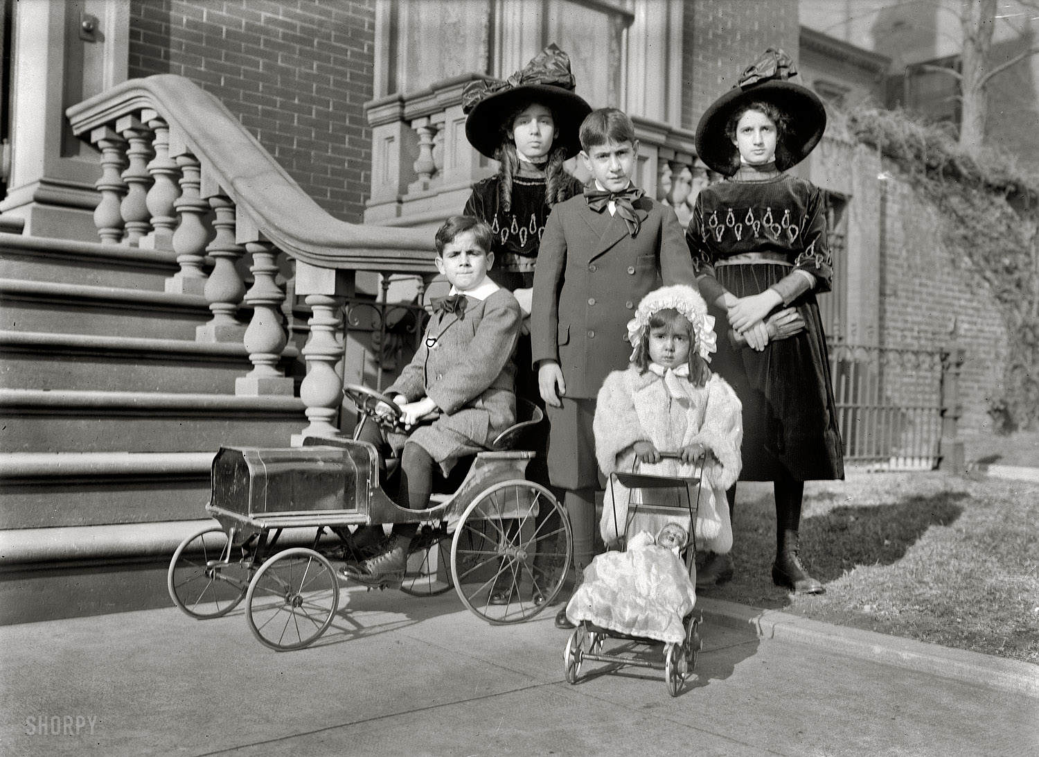 "Naon children, 1912." Romulo Naon Jr., son of the Argentinean ambassador, and siblings. I can't shake the feeling that some Goreyesque mishap is about to befall these gloomy tots. Harris & Ewing Collection glass negative. View full size.