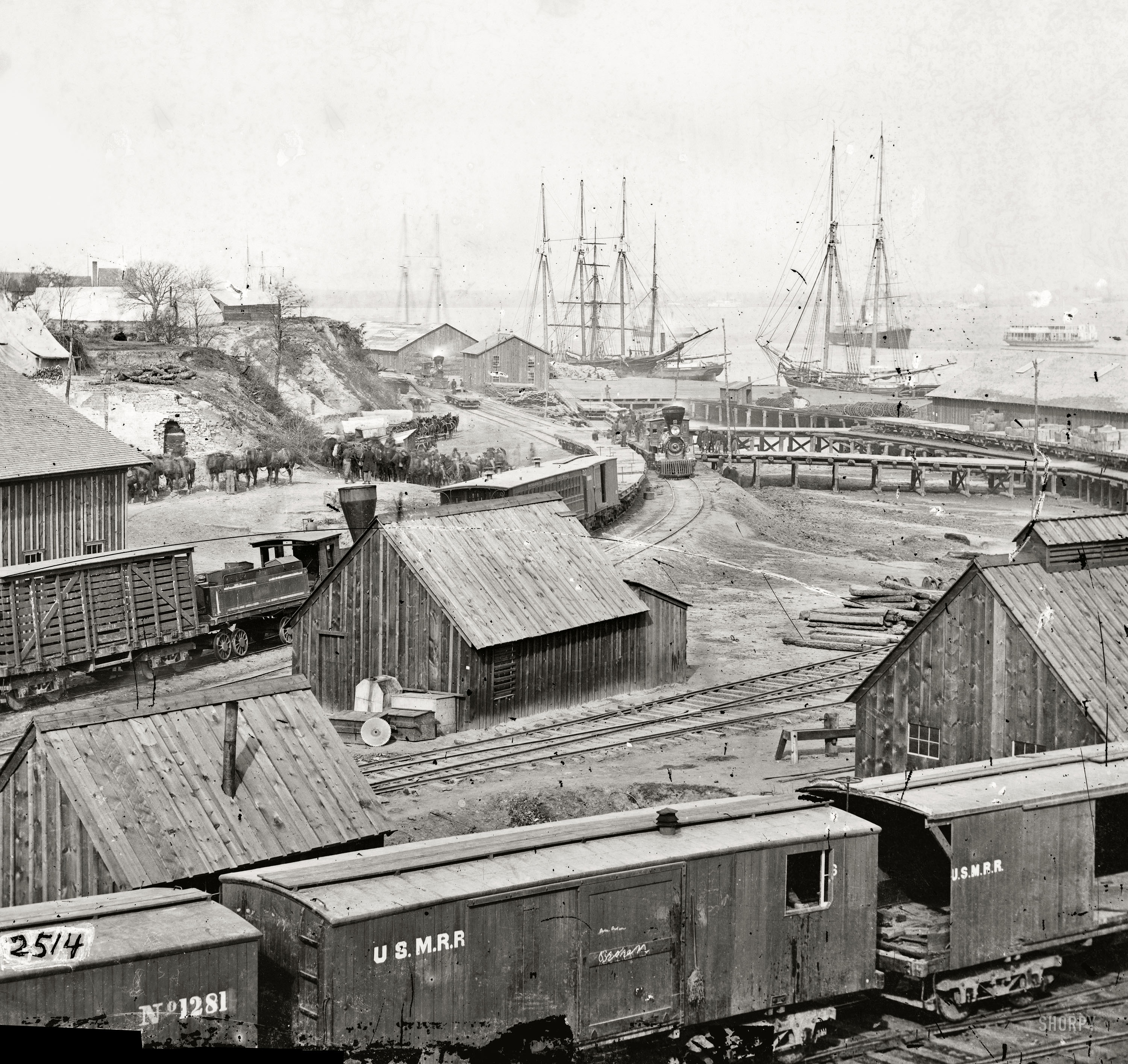 Circa 1865. "City Point, Virginia. Railroad yard and transports." Wet plate glass negative, half of stereograph pair. Studio of Mathew Brady. View full size.