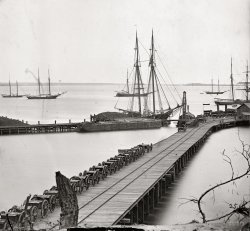 1865. "City Point, Virginia. Wharf, Federal artillery, and anchored schooners." From photographs of the main Eastern theater of war, the siege of Petersburg, June 1864-April 1865. Wet plate glass negative. View full size.