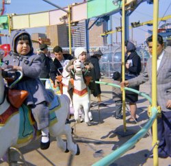 On the Merry-go-round at Coney Island, New York, in 1963. View full size.
Look out!He's got a gun!
Bet the coat was a hand-me-downBy 1963, I don't think coats with leggings were in, so I bet the little girl got hers from an older sister.
Thanks Joe VYou &amp; your sister are darling. Love you family photos brings back so many memories. Good times!
(ShorpyBlog, Member Gallery)