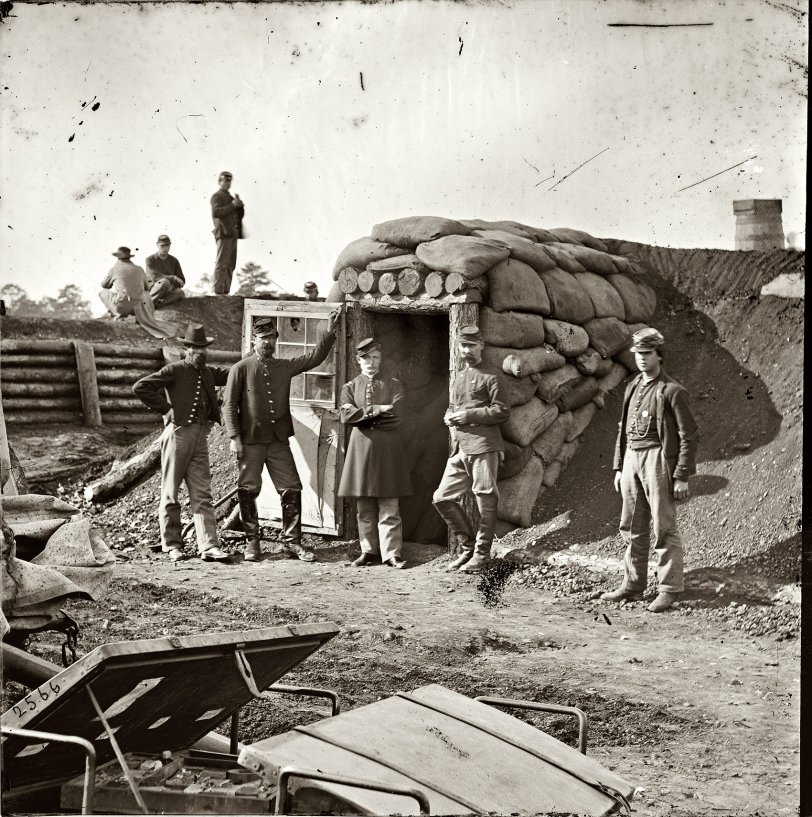 "Fort Burnham, Virginia, the former Confederate Fort Harrison. Federal soldiers in front of bomb-proof headquarters." Photographs from the main Eastern theater of war, the Army of the James, June 1864-April 1865. Wet plate glass negative, half of stereo pair, photographer unknown. View full size. 
