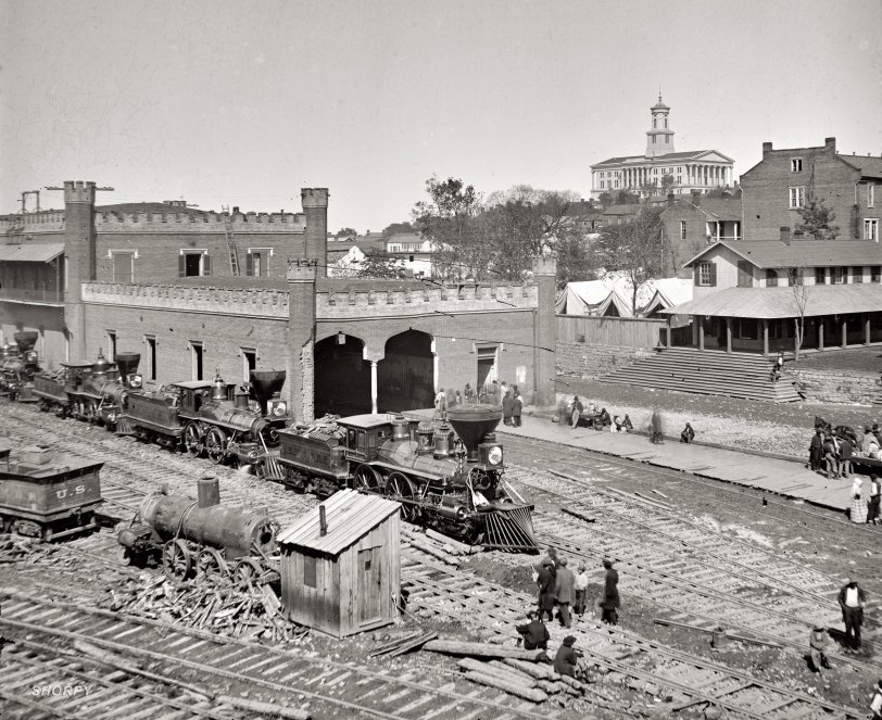 1864. "Nashville. Railroad yard and depot with locomotives; Tennessee Capitol in the distance. From photographs of the War in the West: Hood before Nashville. Continuing his policy of the offensive at any cost, Gen. John B. Hood brought his reduced army before the defenses of Nashville, where it was overthrown by Gen. George H. Thomas on December 15-16, 1864, in the most complete victory of the war. If the date borne on this photograph is correct, it was taken in the course of the battle." Wet plate glass negative by George N. Barnard. View full size.
