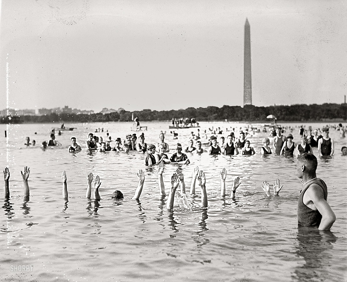 "George H. Corson, 1920" is the caption for this enigmatic and slightly damaged photo of bathers in the Potomac River. National Photo Company. View full size.