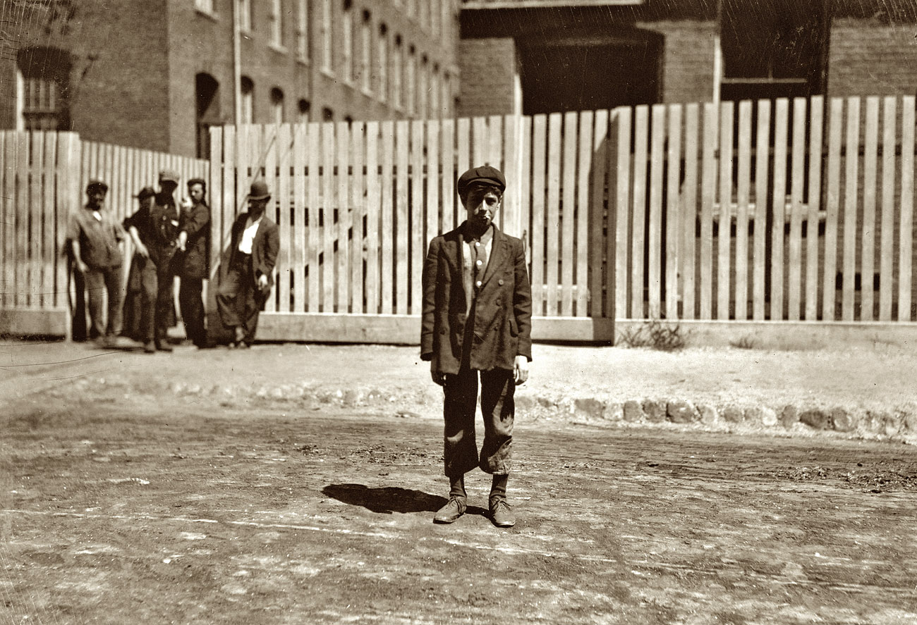 August 1911. New Bedford, Massachusetts. "Arthur Sarasin, 7 Acushnet Block. Works in weaving room. At his house his people said he was fourteen last week." View full size. Photograph and caption by Lewis Wickes Hine.