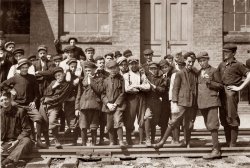 Young workers in front of Indian Mfg. Co., Indian Orchard, Massachusetts. September 1911. Photo by Lewis Wickes Hine. View full size.