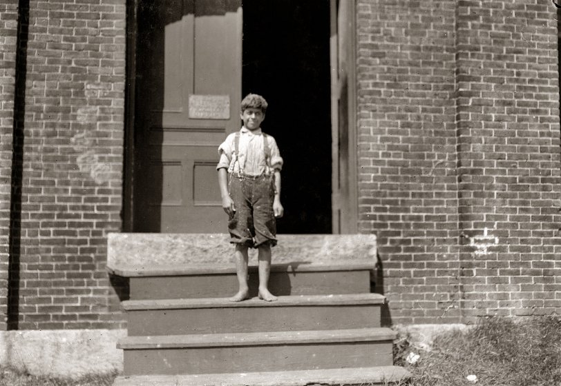 September 1911. Winchendon, Massachusetts. "Batiste Joseph. Doffer in Glenallen Mill. Father and mother said he is 12 years old, has been doffing all summer, will go to school. Query: Will he go to school? Another boy, 13 years old in this mill, said, 'I'll stay at work until they come after me.' Older sister and parents illiterate." Photo and caption by Lewis Wickes Hine. View full size.
