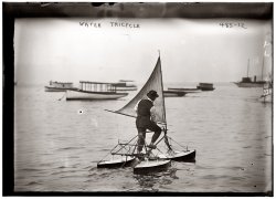 "Man operating water tricycle" (Supplemented by wind power?)  Circa 1913. View full size. 5x7 glass negative, George Grantham Bain Collection.