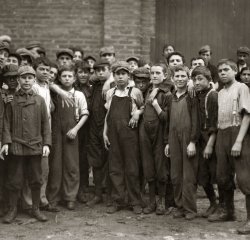 Young workers at a Lawrence, Massachusetts, manufacturing concern (fabric mill or cannery). September 1911. View full size. Photograph by Lewis Wickes Hine.
Whew...this looks to be a no-nonsense, take-no-prisoners crowd of boys; wonder if Hine got away with his camera intact? :)
Denny Gill
Chugiak, Alaska
(The Gallery, Kids, Lewis Hine)