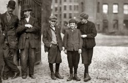October 1911. Lowell, Massachusetts. "Robert Magee (smallest), 270 Suffolk Street, apparently 12 years, been working in Mule Room #1, Merrimac Mill, one year. Michael Keefe (next in size), 32 Marion Street, been at work in #1 Mule Room for eight months; apparently 13 years old. Cornelius Hurley, 298 Adams Street, been at work in #1 Mule Room for six months; about 13 or 14 probably." Photograph and caption by Lewis Wickes Hine. View full size.