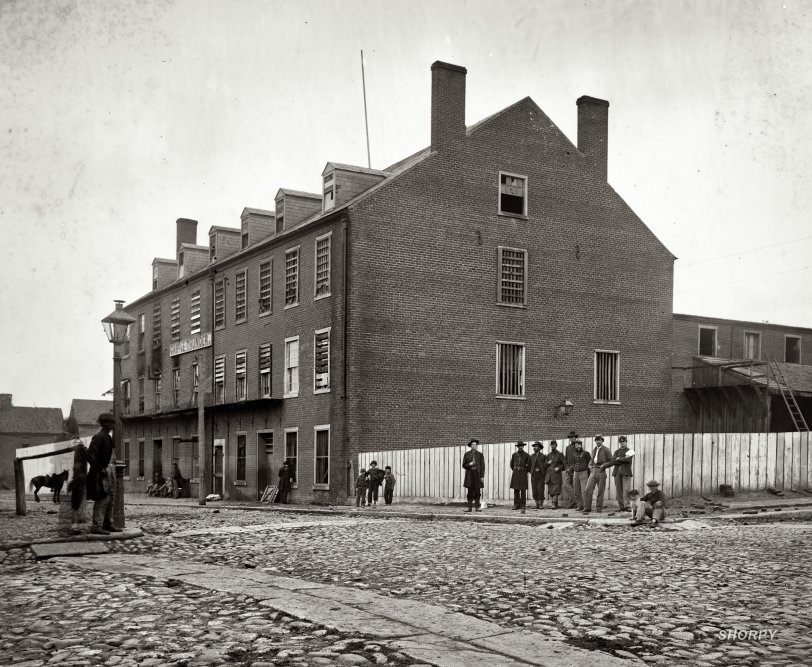 Richmond, 1865. "Castle Thunder, Cary Street. Converted tobacco warehouse for political prisoners." Main Eastern theater of war, fallen Richmond, April-June 1865. Wet plate glass negative, photographer unknown. View full size.
