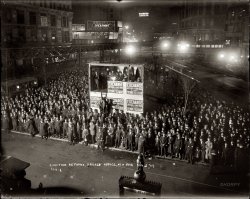 November 2, 1909. Watching the municipal election returns at the offices of the New York Herald and Evening Telegram, with the results beamed out from the projection booth using slides. William Gaynor was elected mayor. 8x10 glass negative, George Grantham Bain Collection. View full size. Lots to see here.