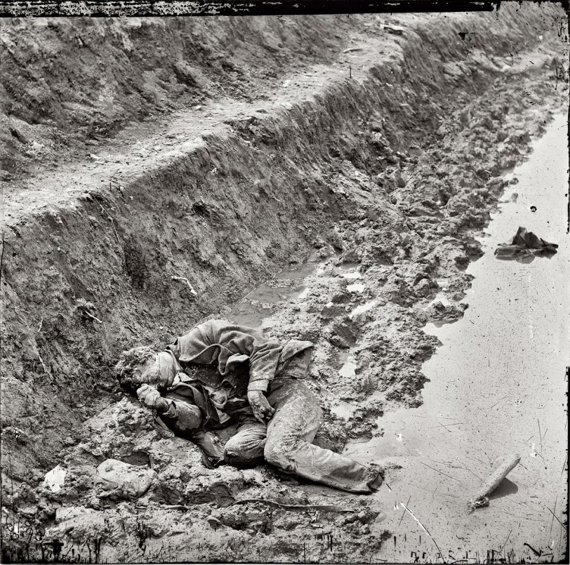 April 3, 1865. Petersburg, Virginia. "Dead Confederate soldier in trenches of Fort Mahone." Wet plate glass negative, right half of stereo pair, by Thomas C. Roche. Civil War glass negative collection, Library of Congress. View full size.
