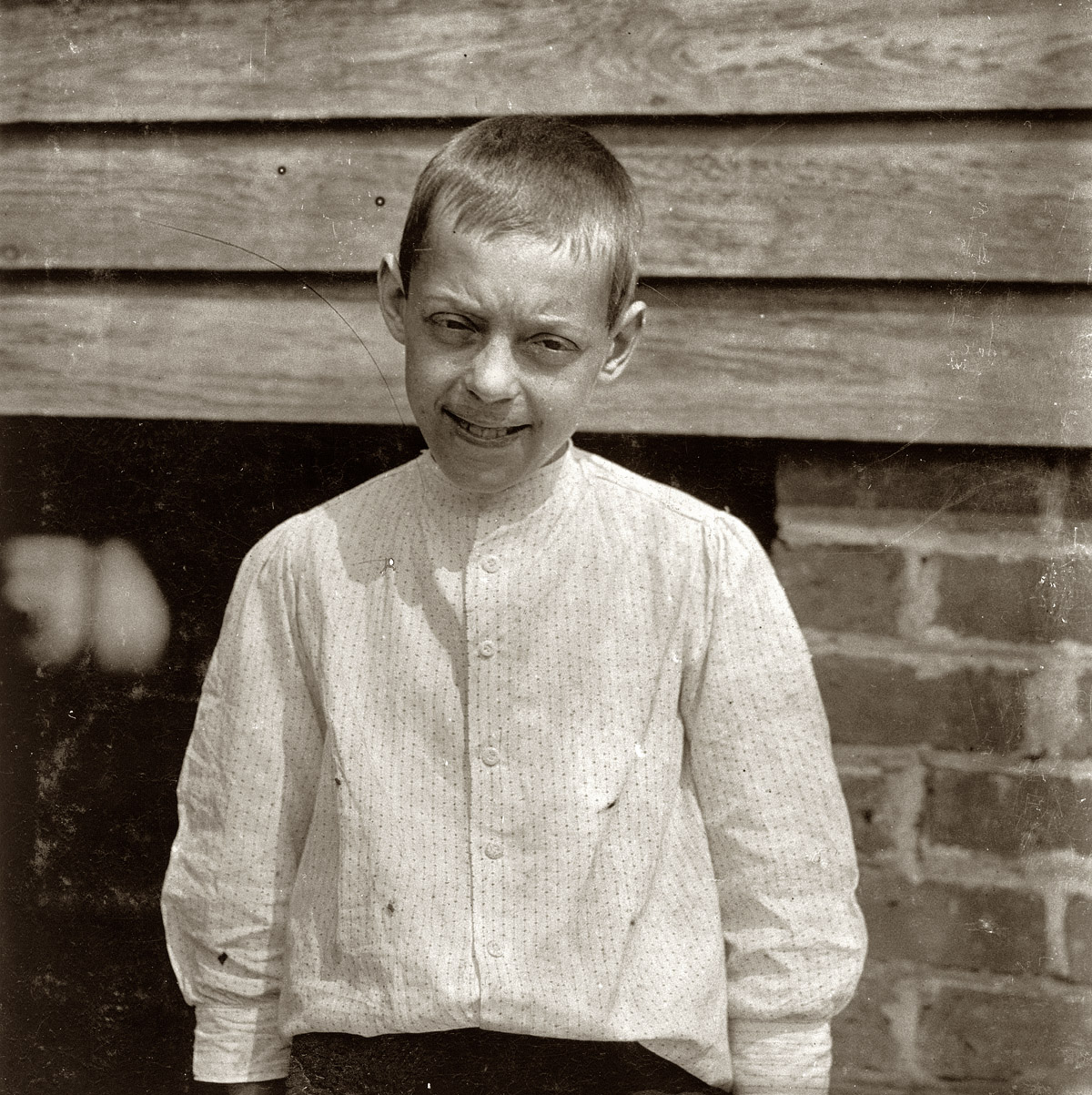May 1912. Spartanburg, South Carolina. Tom Polk, "goin' on 13." Prematurely old, works in Beaumont Mill. View full size. Photograph by Lewis Wickes Hine.