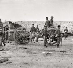 April 1865. "Petersburg, Virginia. Federal soldiers removing artillery from Confederate fortifications." Wet plate glass negative. View full size.