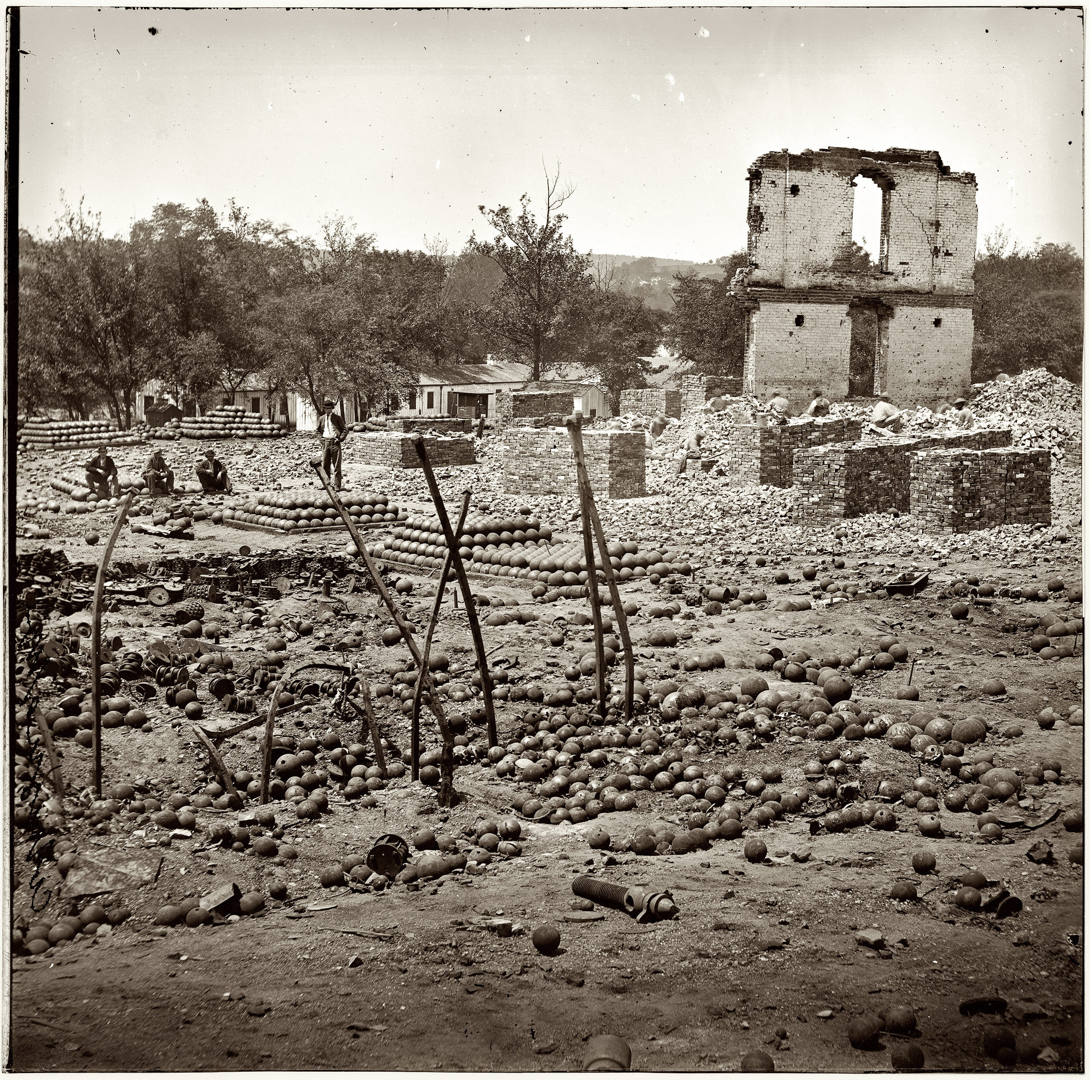 April 1865. Ruins of the State Arsenal at Richmond showing stacked and scattered ammunition. From photographs of the main Eastern theater of war after the fall of Richmond, compiled by Hirst Milhollen and Donald Mugridge. View full size.