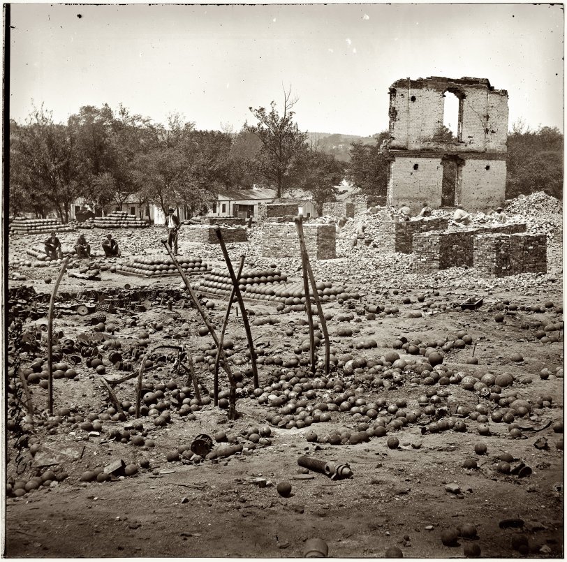 Photo of: Confederate Arsenal: 1865 -- April 1865. Ruins of the State Arsenal at Richmond showing stacked and scattered ammunition. From photographs of the main Eastern theater of war after the fall of Richmond, compiled by Hirst Milhollen and Donald Mugridge. View full size.