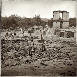 April 1865. Ruins of the State Arsenal at Richmond showing stacked and scattered ammunition. From photographs of the main Eastern theater of war after the fall of Richmond, compiled by Hirst Milhollen and Donald Mugridge. View full size.