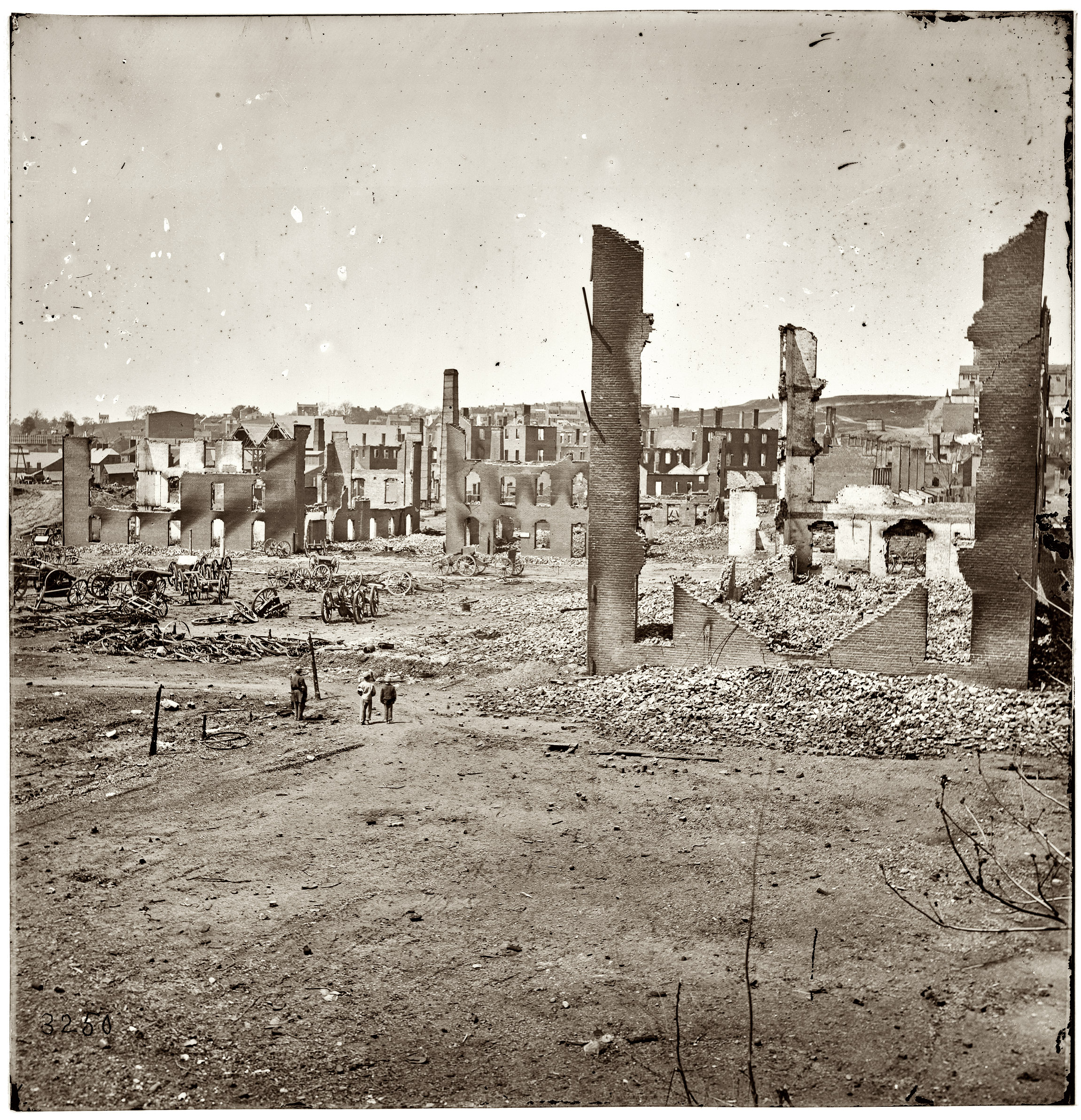 April 1865. "Burnt District, Richmond, Virginia. Ruins in the State Arsenal yard." View full size. Half of a wet-plate glass stereograph.