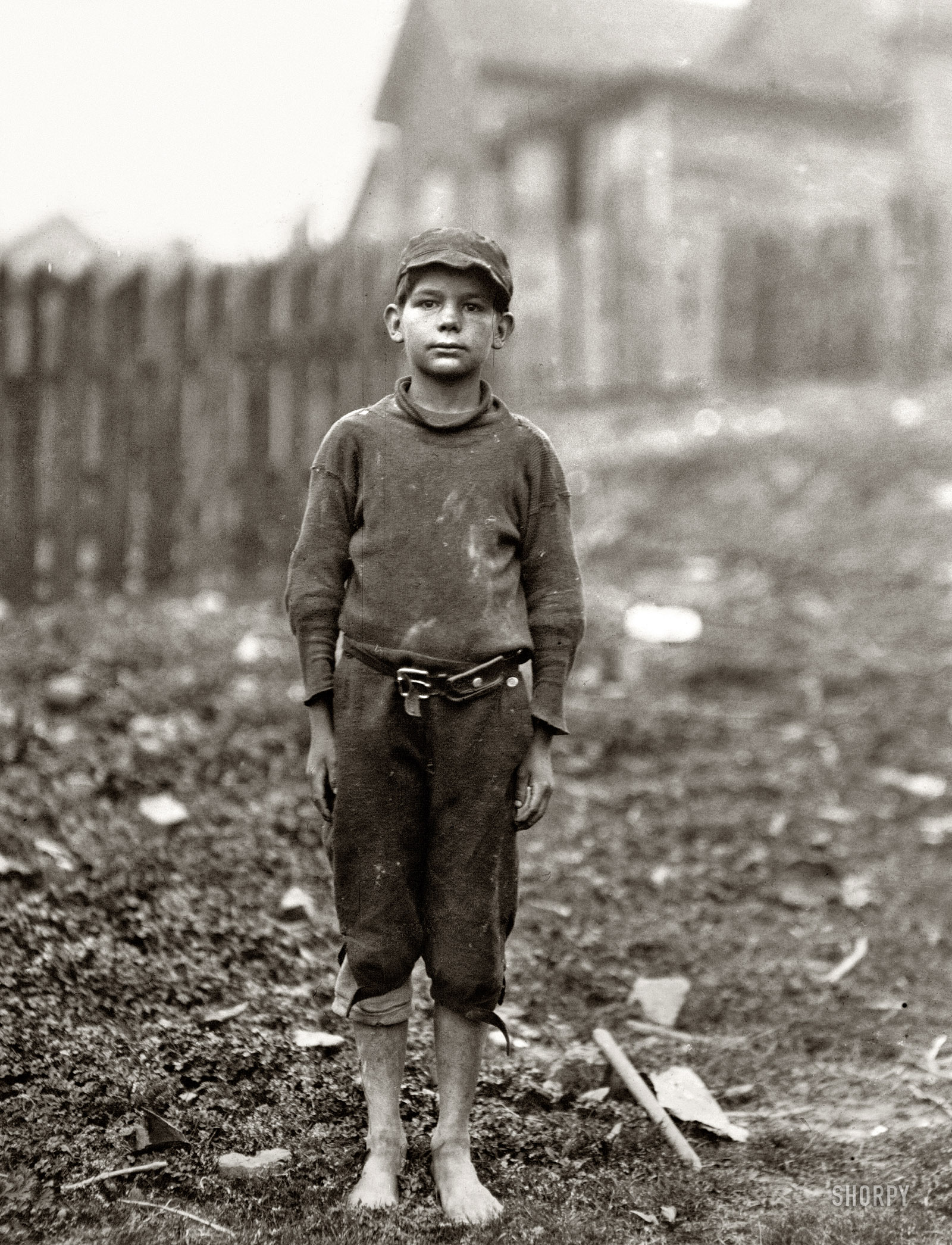 April 1913. Rome, Georgia. Neil Power, 10 years old. Said "turns stockings in Rome Hosiery Mill." A shy, pathetic figure. "Hain't been to school much." Photo and caption by Lewis Wickes Hine. View full size.