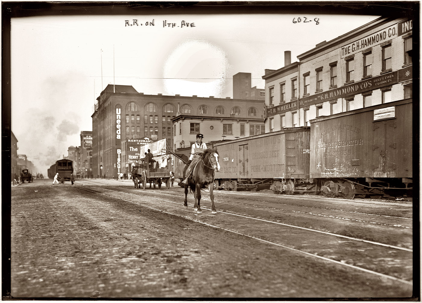 Mounted flagman and freight. Another circa 1911 view of the Eleventh Avenue rail line in New York near West 26th Street. View full size. George Grantham Bain Collection. The light spot at the top is from deterioration of the emulsion.