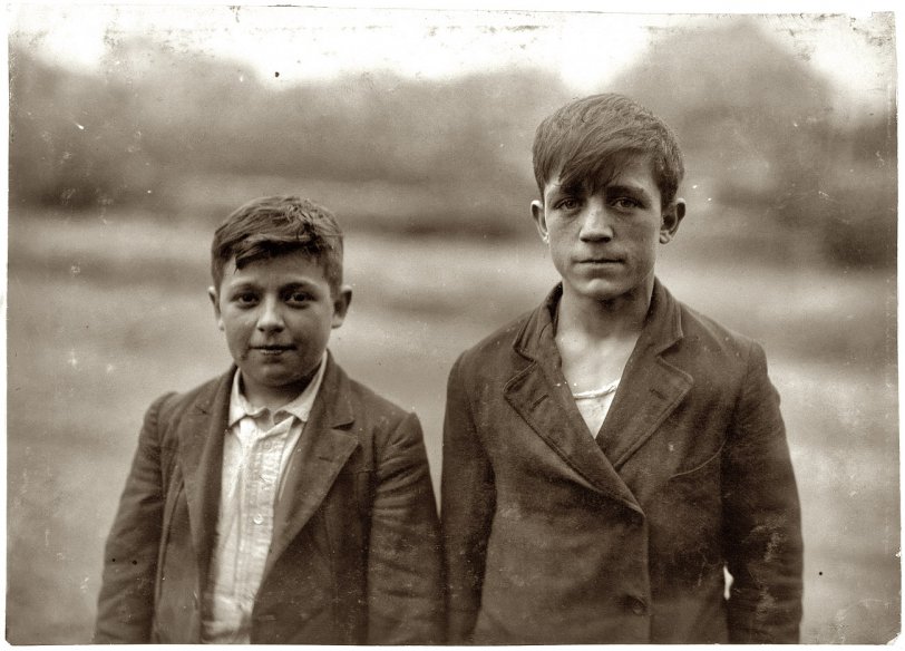 Photo of: Al and Frank: 1916 -- June 12, 1916. Albert Heon, 14, and Frank Migneault, 15. Doffers at Kerr Thread in Fall River, Massachusetts. View full size. Photograph by Lewis Wickes Hine.