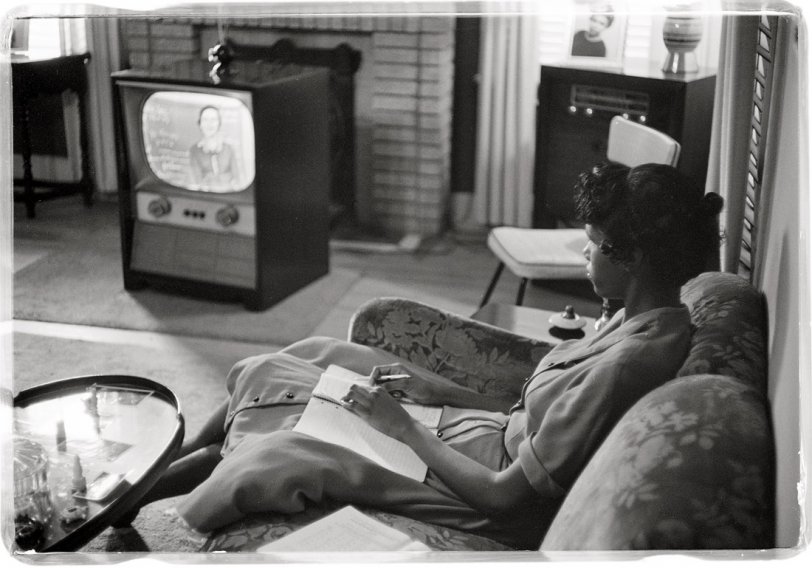 "African American high school girl being educated via television during the period that the Little Rock (Arkansas) schools were closed to avoid integration." September 1958. View full size. Photograph by Thomas J. O'Halloran, USNWR.