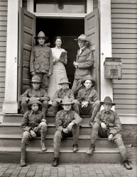 "Boy Scouts, 1913." Our thrifty Scouts again, with the postmistress seen here yesterday. Harris & Ewing Collection glass negative. View full size.