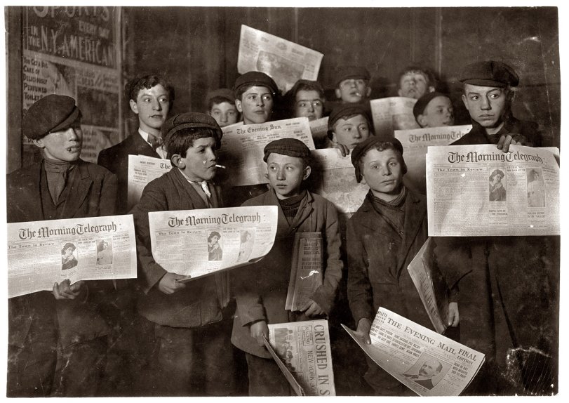 2 A.M. February 12, 1908. "Papers just out. Boys starting out on morning round. Ages 13 years and upward. At the side door of Journal Building near Brooklyn Bridge, New York."  Photo and caption by Lewis Wickes Hine. View full size.