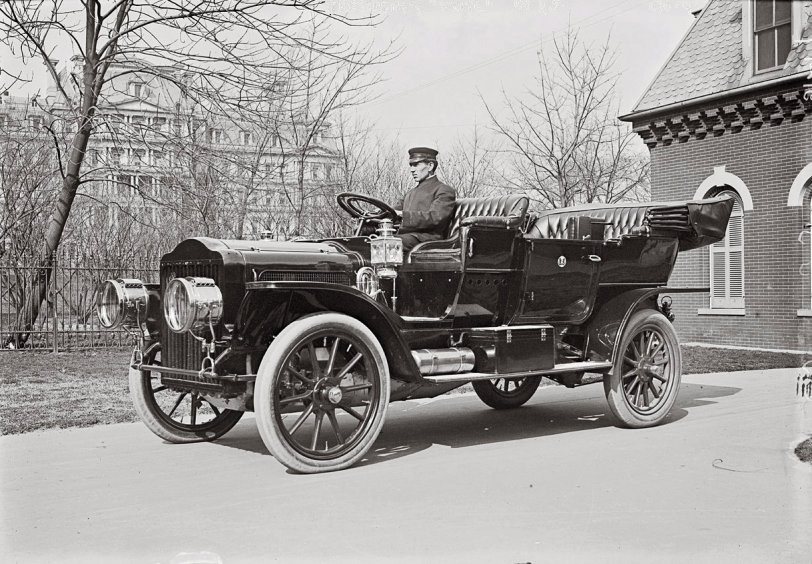 The President's 40-horsepower White Model M steam-powered touring car. March 1909. Photographed on the White House grounds in the early days of the Taft administration. In the back is the State Department, now the Eisenhower Executive Office Building. View full size. George Grantham Bain Collection. Question for the old-car experts: Does each tire really have multiple valve stems?