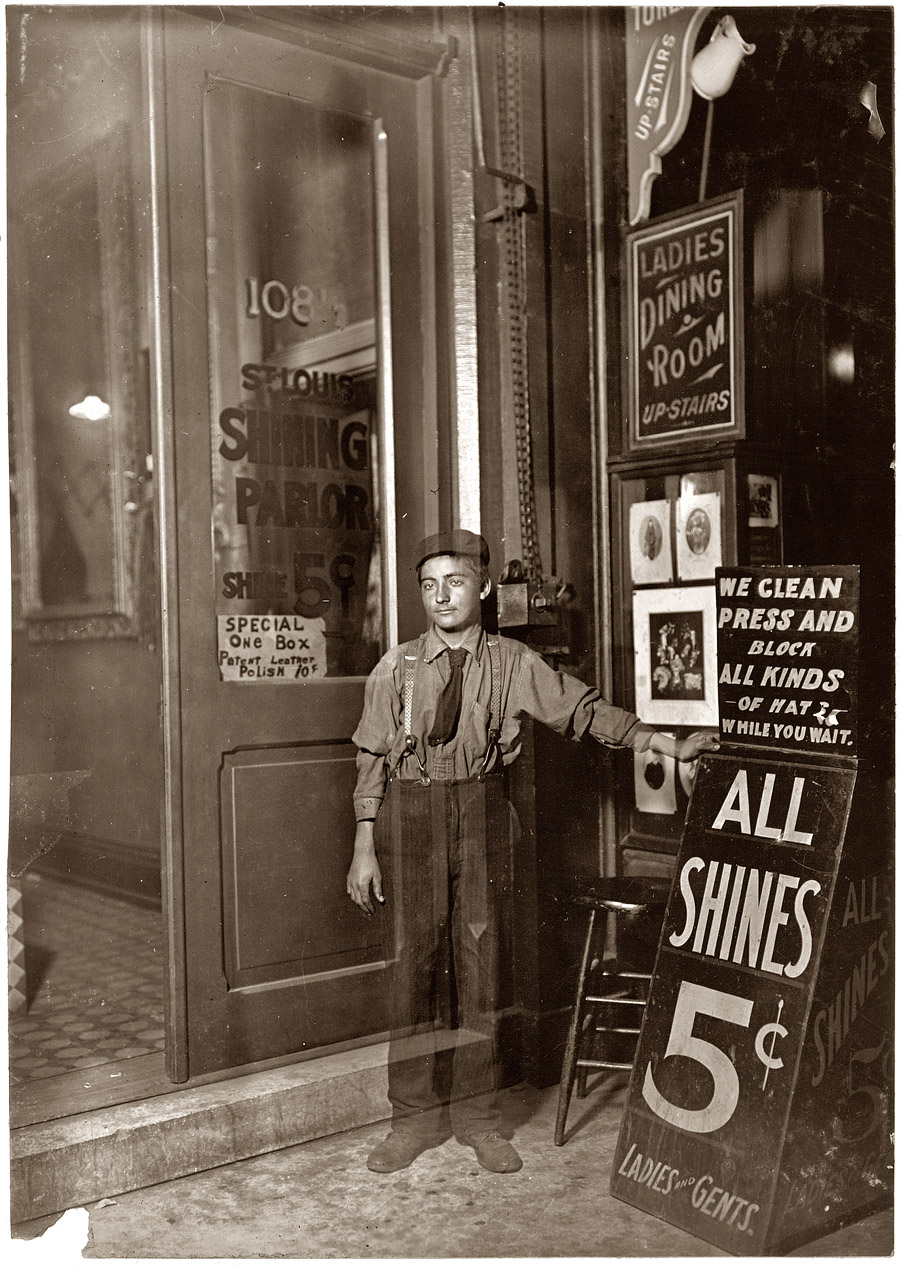August 1908. "Greek bootblack in Indianapolis." An interesting example of a time exposure where the subject either enters the frame after the shutter opens or leaves it before it closes. View full size. Photograph by Lewis Wickes Hine.