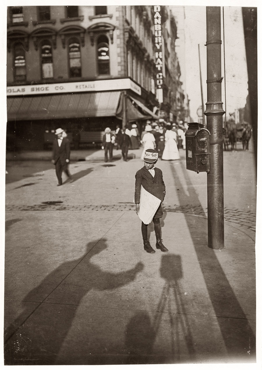 John Howell, an Indianapolis newsboy. Makes 75 cents some days. Begins at 6 A.M., Sundays. Lives at 215 W. Michigan St. August 1908. View full size. Photograph by Lewis Wickes Hine. This is as close to a Hine self-portrait as we've seen. Who can tell us about Celery Cola?