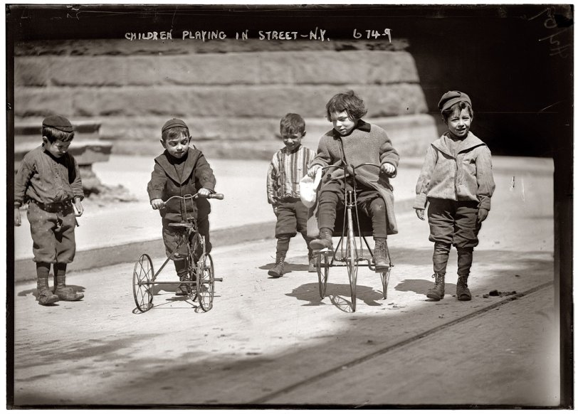 Children playing on the street somewhere in New York City. April 2, 1909. View full size. 5x7 glass negative, George Grantham Bain Collection.
