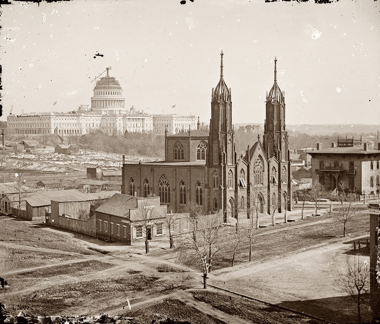 "Trinity Episcopal Church, 3rd & C & Ind. Ave." Unfinished Capitol in the background, circa 1863-64. View full size. Brady-Handy Collection.