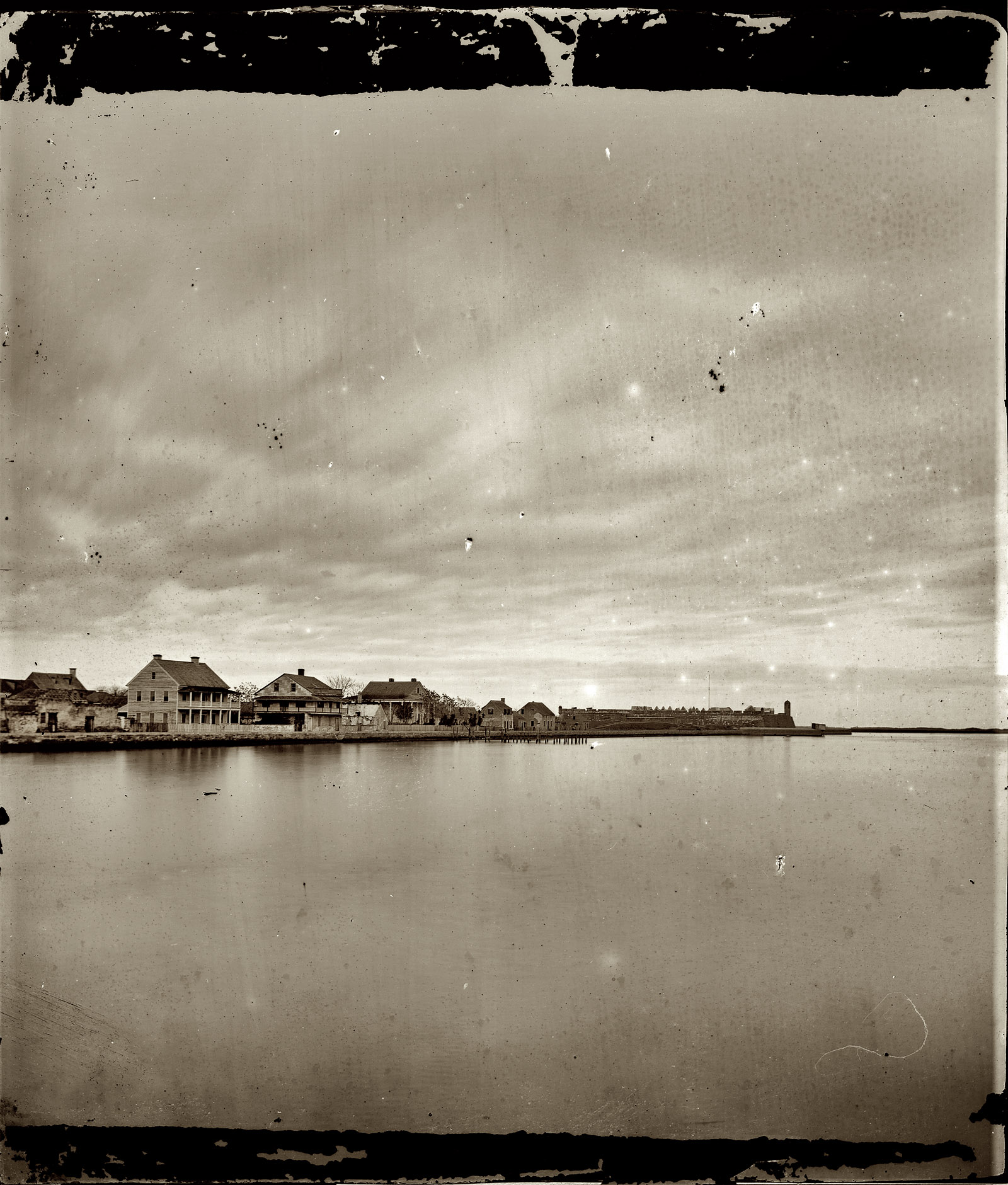 St. Augustine, Florida, circa 1865. "View of town from bay." View full size. Wet-plate glass negative, left half of stereo pair, by Samuel A. Cooley.