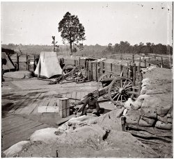 1864. Union Army soldier at Confederate fortifications outside of Atlanta. Wet collodion glass-plate negative by George N. Barnard. View full size.