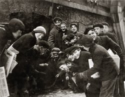 February 1910. "A crap game in the paper alley. Rochester, New York." Newsies gotta have some fun, right? Photograph by Lewis Wickes Hine. View full size.
