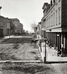 1864. "Atlanta, Georgia. Street view." To the right, a hatter. Everywhere else, dirt and mud. Wet plate glass negative by George N. Barnard. View full size.