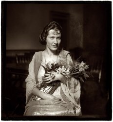 February 5, 1921. "Miss Bertha May Graf, chosen the prettiest girl at suffrage headquarters in Washington, will be chief flower girl at the National Woman's Party convention." View full size. National Photo Company Collection.