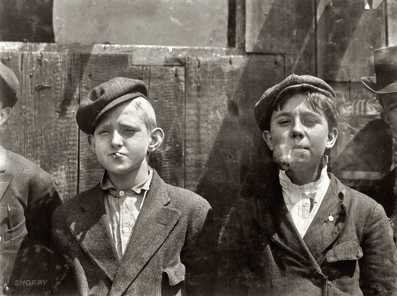 11 a.m. May 9, 1910. St. Louis, Missouri. "Newsies at Skeeter's branch. They were all smoking." Photograph and caption by Lewis Wickes Hine. View full size.