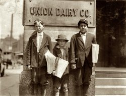 St Louis, Mo. Truants selling papers at Jefferson & Washington. 11 a.m. Monday May 9, 1910. Smallest boy is Marvin Adams, 2637 Washington Avenue. Said he got his papers "off'n de other feller." Other boy is Owen McCormack, 2651 Washington Avenue. View full size. Photo and caption by Lewis Wickes Hine.