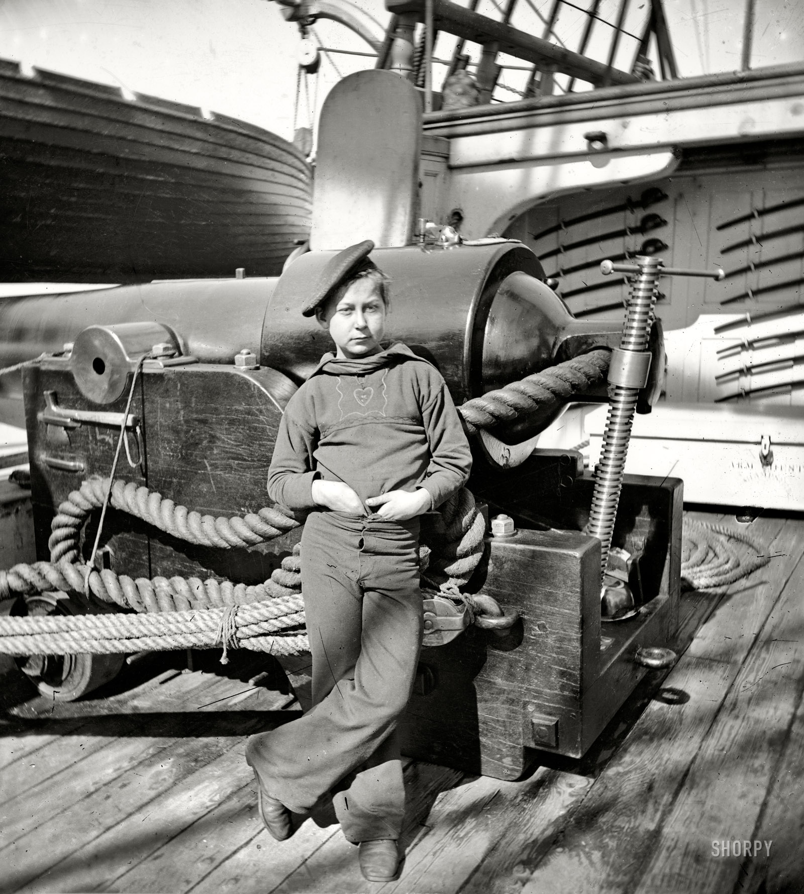 Circa 1864-65. "Powder monkey by gun of U.S.S. New Hampshire, Federal depot ship off Charleston, South Carolina." Wet plate glass negative. View full size.
